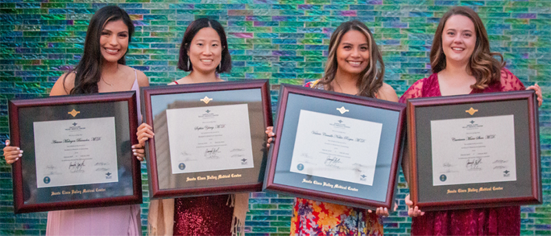 three resident holding their diploma