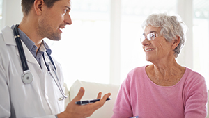 older woman talking to doctor