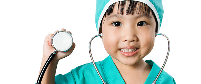 A child dressed up as a doctor