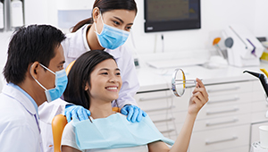 Dentist, assistant and patient